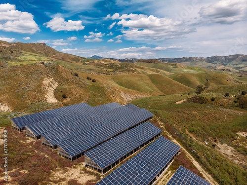 Farm of solar panels for production of alternative eco electricity. Aerial top view.