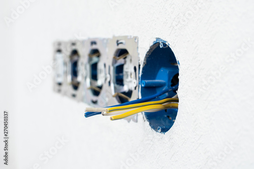 electrical sockets in a white wall