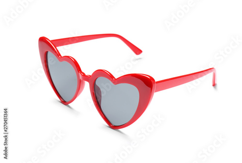 Stylish heart shaped glasses on white background