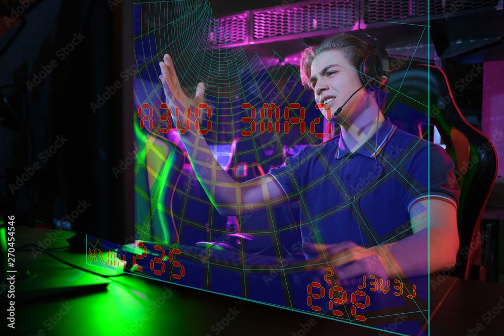 Obraz premium Professional young caucasian gamer playing online on his PC. He upset because of losing the game