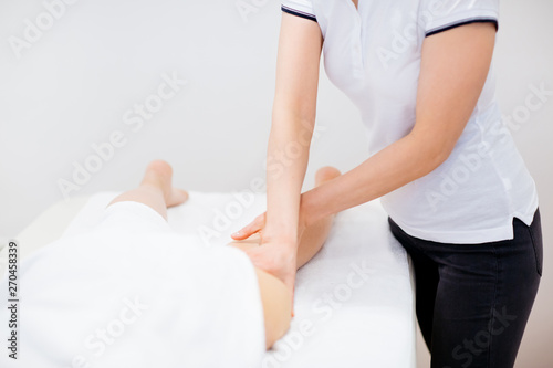 Woman having a massage in a medical center  © Astarot