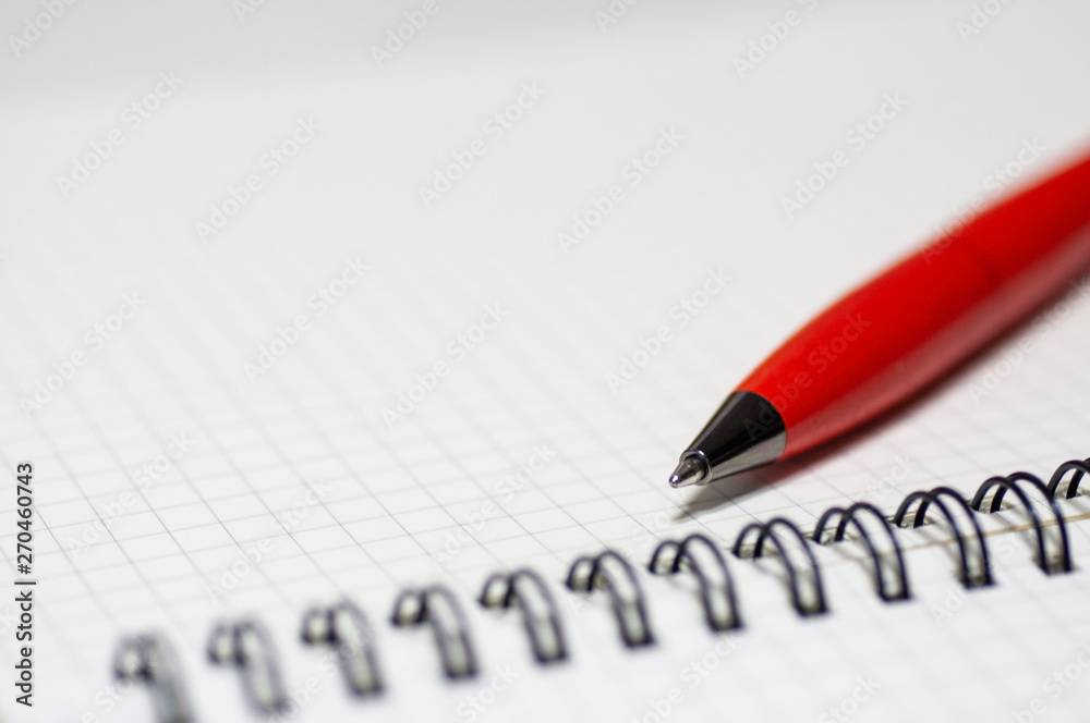 Close up graph book note with orange pen with space. Close up graph book note with orange pen with space.