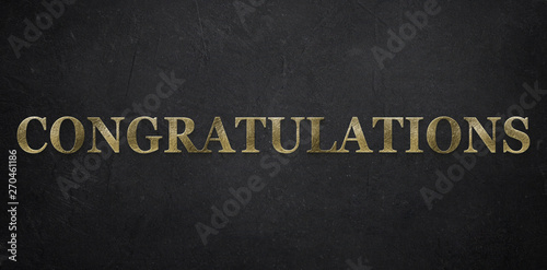Gold-colored "Congratulations" message on paper background