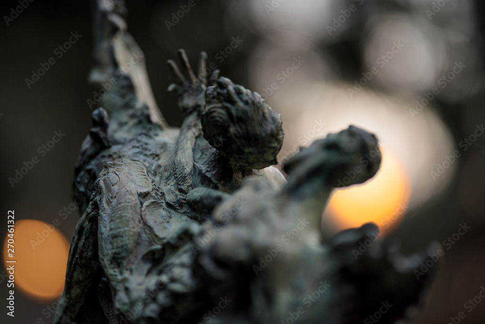 statue of dancers at sunset with bokeh background statue of dancers at sunset with bokeh background