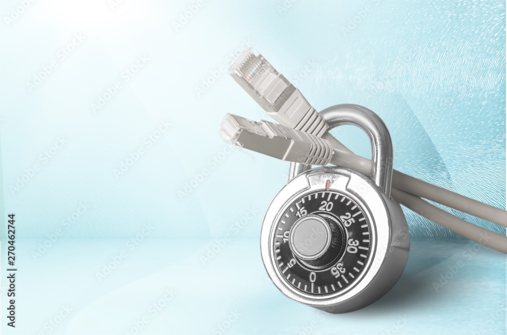 Lock and network cable on background. Lock and network cable on background.