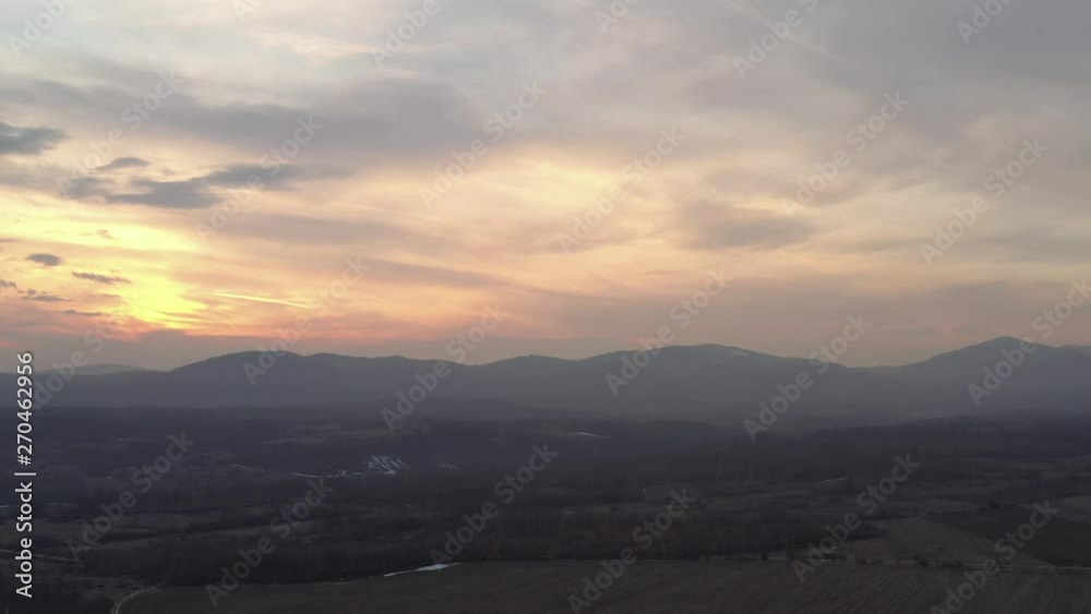 Colorful sky above mountains Stol and Deli Jovan 4K drone video
