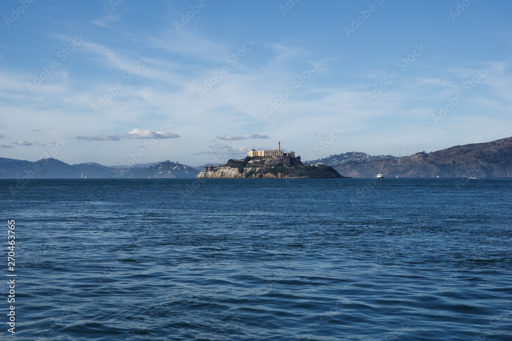 SAN FRANCISCO, CALIFORNIA, UNITED STATES - NOV 25th, 2018: Alcatraz, the silent cold prison in the bay as seen from pier 39