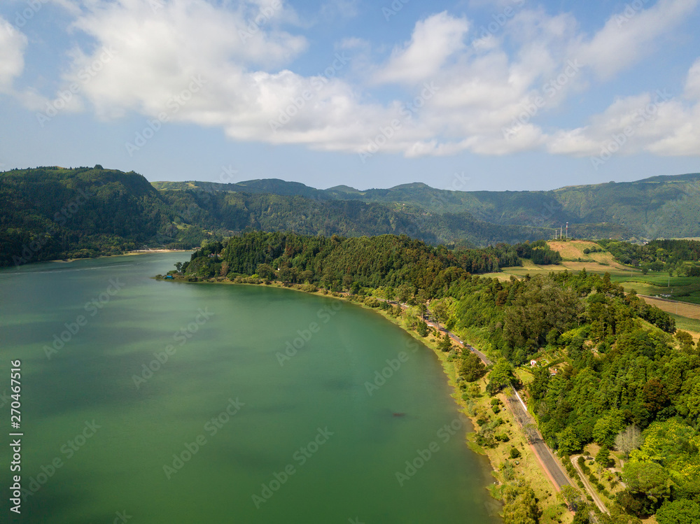 Aerial view of beautiful Furnas lagoon in the Azores islands. Drone landscape view with lines and textures in the background. Top view of volcanic crater, tourist attraction of Portugal.