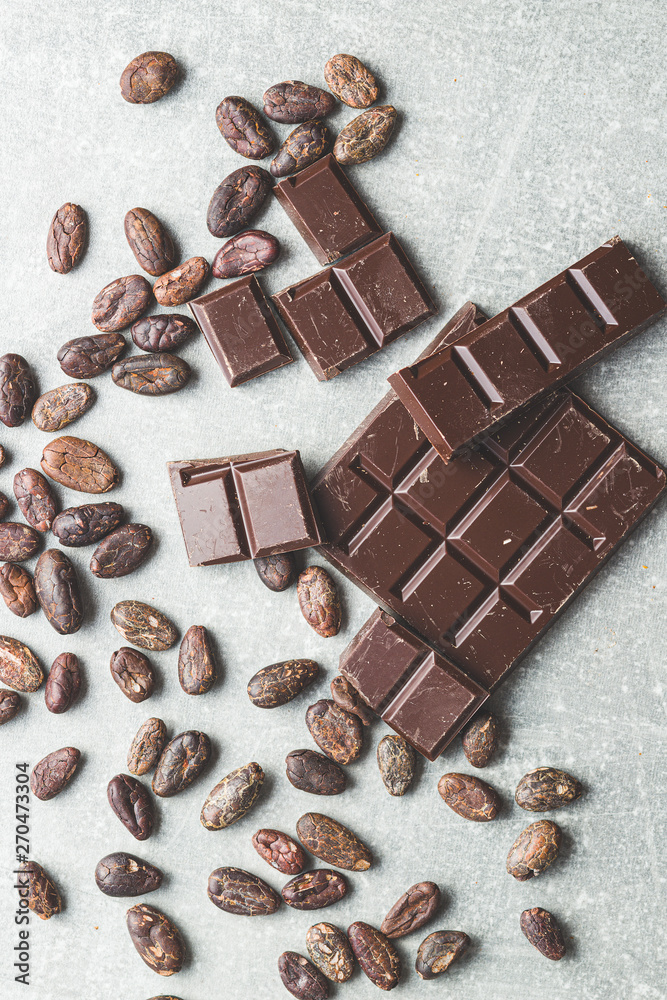 Dark chocolate bar and cocoa beans. Dark chocolate bar and cocoa beans.