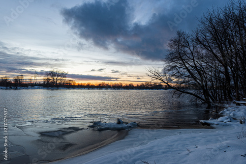 frozen river in winter countryside