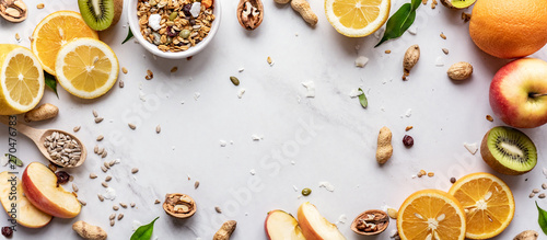 Healthy food vegan breakfast nutrition concept, fresh summer fruits granola seeds on white background table, detox diet for health care, top view copy space, horizontal wide banner for website design