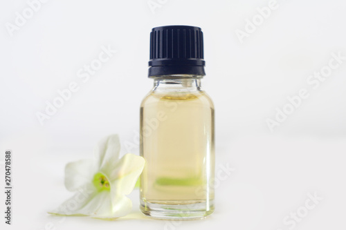winged tobacco essential oil in beautiful bottle on White background