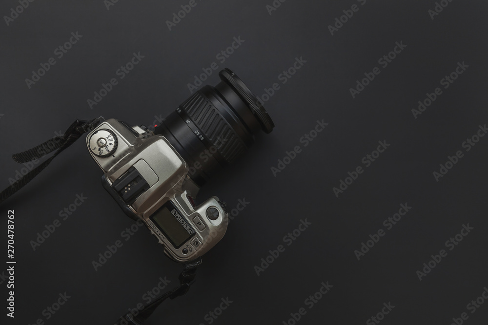 Photographer workplace with dslr camera system on dark black table background. Hobby travel photography concept. Flat lay top view copy space Photographer workplace with dslr camera system on dark black table background. Hobby travel photography concept. Flat lay top view copy space