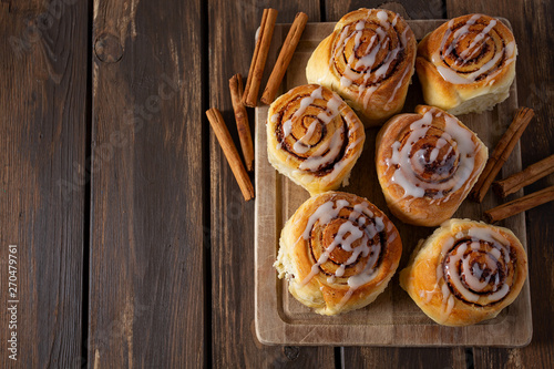 cinnamon rolls on wooden surface