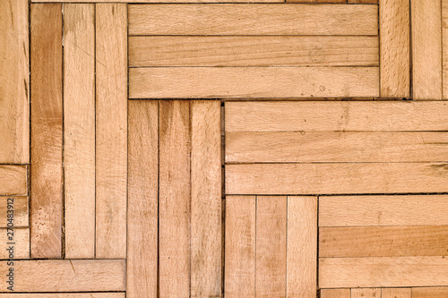 Damaged parquet from moisture and water from bathroom