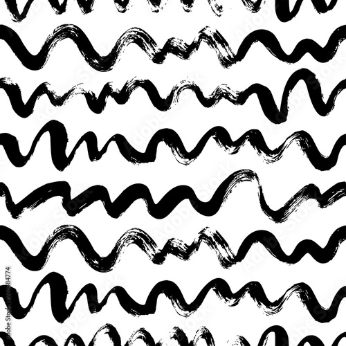Wavy lines hand drawn seamless pattern. Brush grunge vector texture.