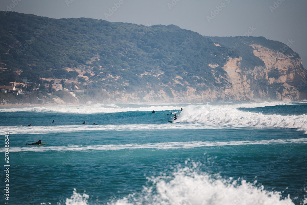 Surfers on the sea with waves Surfers on the sea with waves