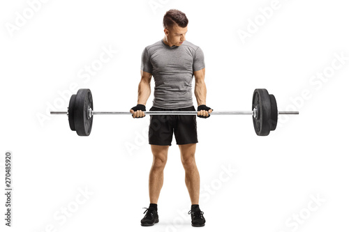 Young fit guy lifting weights