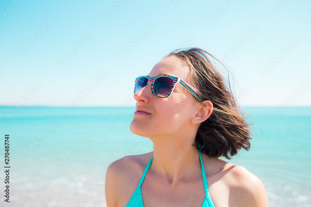 girl smiling near the ocean