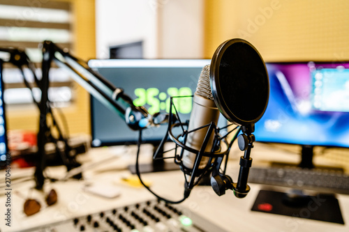 Microphone and mixer at the radio station studio broadcasting news photo
