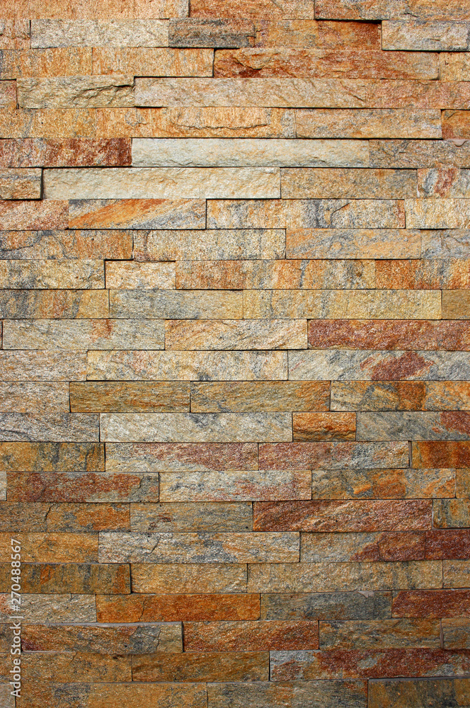 Naklejka premium texture of textured brown stone wall