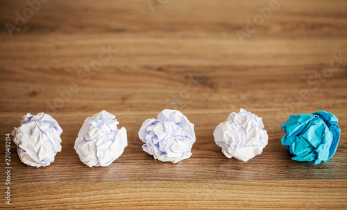 Creative idea concept.Inspiration, New idea and Innovation concept with Crumpled Paper on wood background