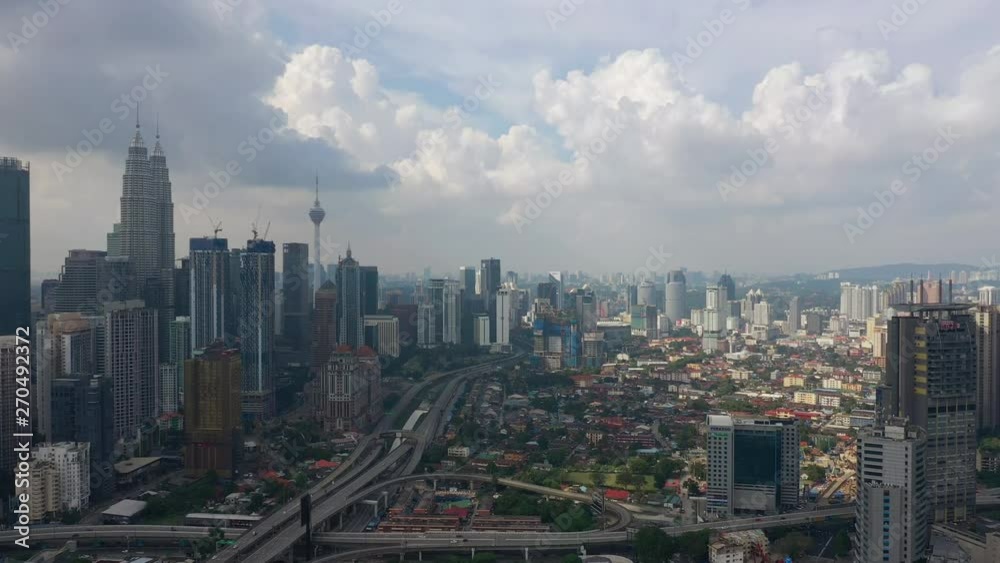 sunny day flight over kuala lumpur city downtown traffic road jam aerial panorama 4k malaysia sunny day flight over kuala lumpur city downtown traffic road jam aerial panorama 4k malaysia