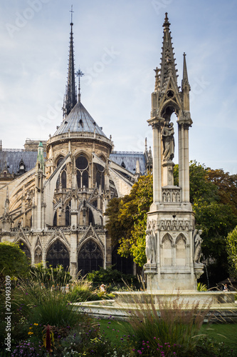 The back of Notre Dame Cathedral from the park in summer in Paris