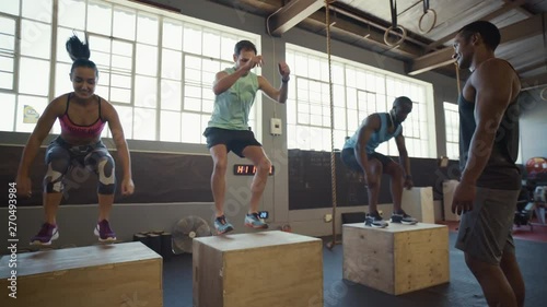 Crossfit class doing box jumps