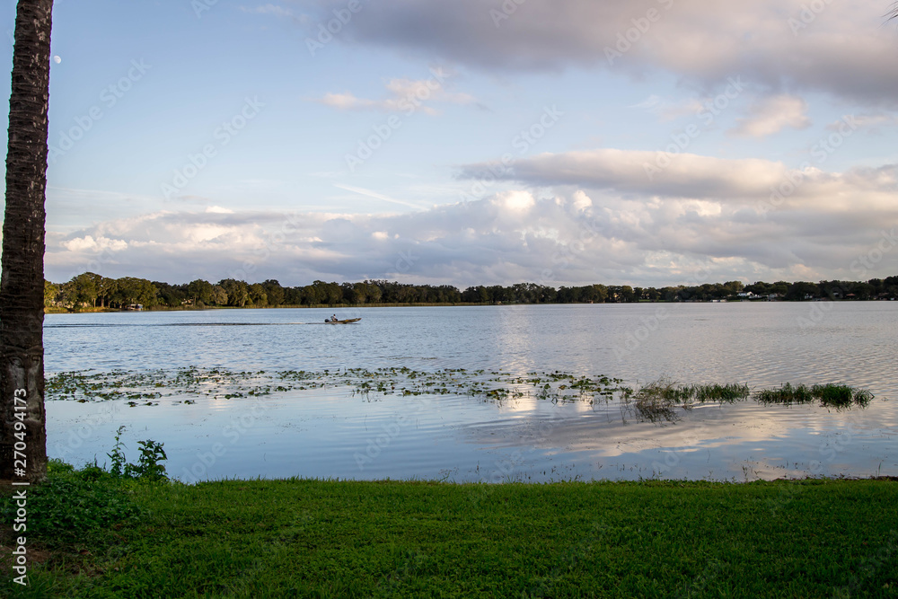 Beautiful cloudy sky reflected over the water