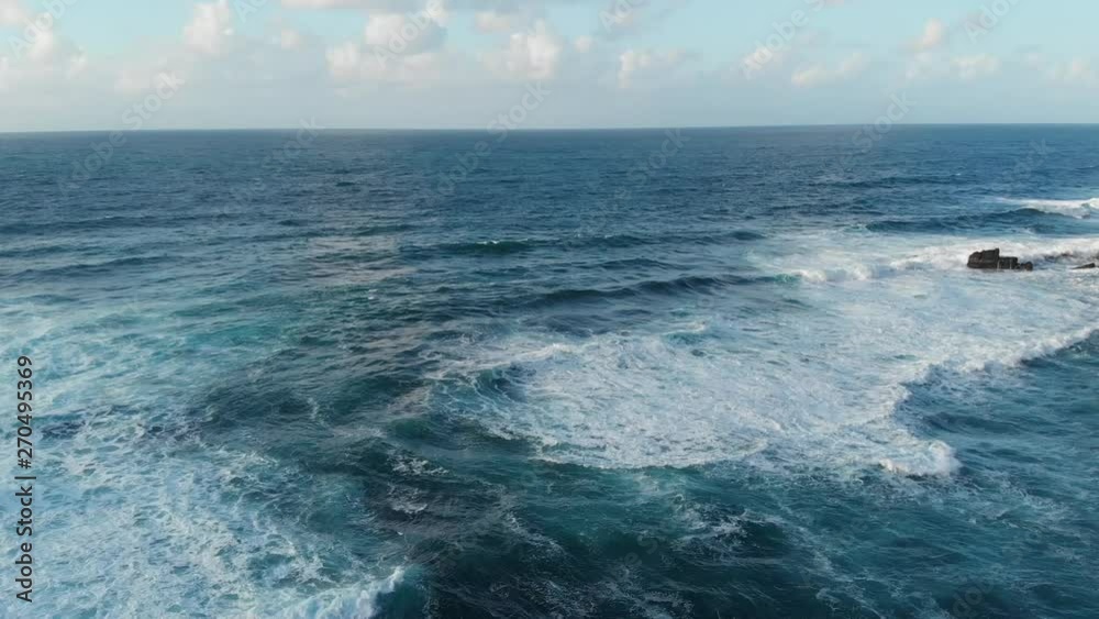 Drone Aerial Portugal Azores Fly out over deep blue ocean on clear day Drone Aerial Portugal Azores Fly out over deep blue ocean on clear day