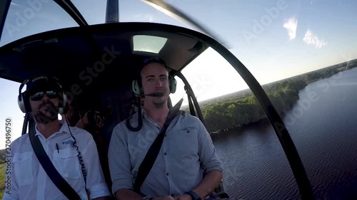 POV from pilot and tourists from the inside of a heliopter while flying over the Okavango Delta photo