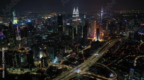 Wallpaper Mural night time flight over kuala lumpur city downtown traffic road junction aerial panorama 4k malaysia Torontodigital.ca