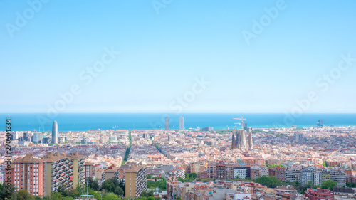 Barcelona city aerial view in Catalonia, Spain, cityscape with the Sagrada Familia at the middle far end.