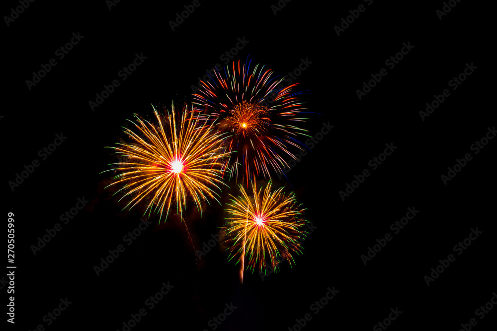 Beautiful colorful fireworks display on the sea beach, Amazing holiday fireworks party or any celebration event in the dark sky.