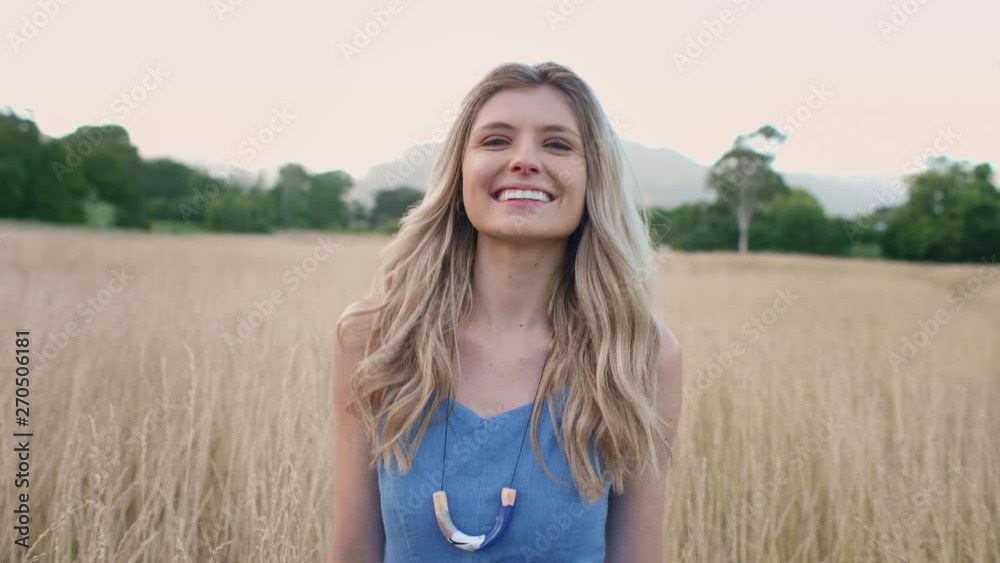 beautiful blonde woman walking and smiling beautiful blonde woman walking and smiling