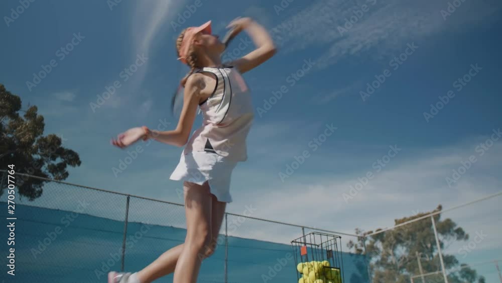 Young girl at tennis training