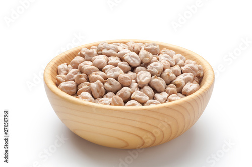 Dry chickpea in a wooden bowl isolated on white background.