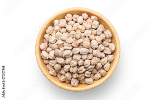 Dry chickpea in a wooden bowl isolated on white background. Top view. photo