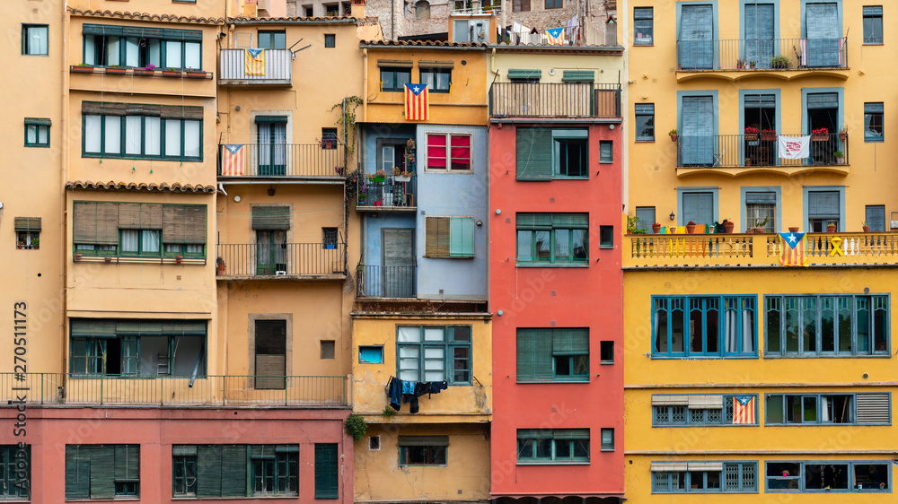 Multi colored houses on the bank of the Onyar River, Girona, Spain