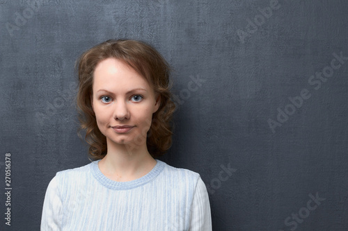 Portrait of smiling young woman with fair hair © Andrei Korzhyts