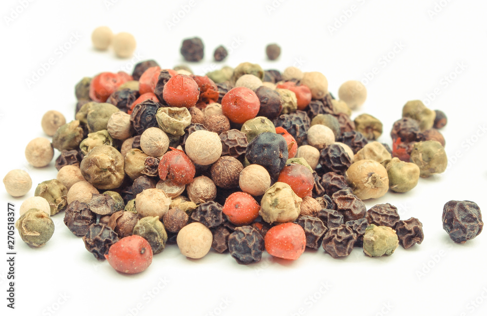 Colored pepper on white background. Cooking spice Colored pepper on white background. Cooking spice