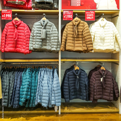 Front of Uniqlo store. Luxury and fashionable brand window display. Winter collection Welcoming the Christmas Festival.