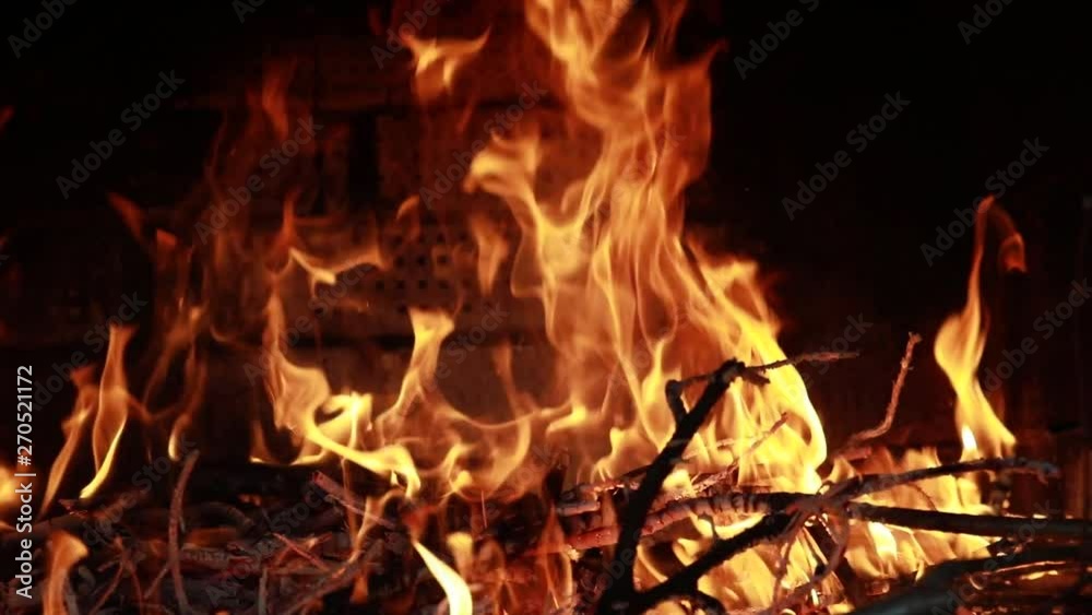 Beautiful orange and red tongues of fire dancing in the fireplace Beautiful orange and red tongues of fire dancing in the fireplace