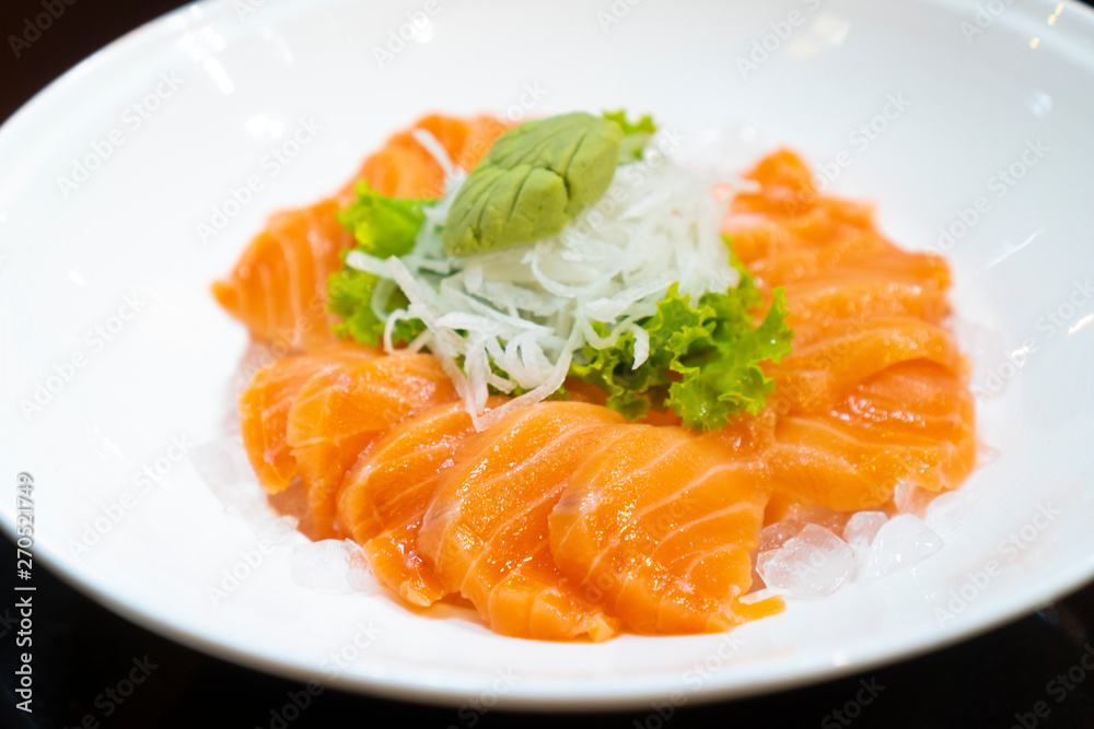 Japanese fresh salmon sashimi or Japanese gourmet and delicacy sashimi with raw sliced fish Japanese fresh salmon sashimi or Japanese gourmet and delicacy sashimi with raw sliced fish