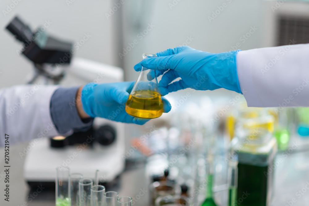 the scientist,doctor, make alternative herb medicine with herbal the organic natural in the laboratory. oil capsule, natural organic skincare and cosmetic