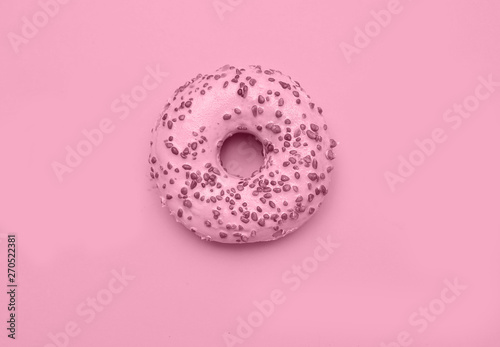 Delicious donut on light pastel color background. National Donut Day concept.
