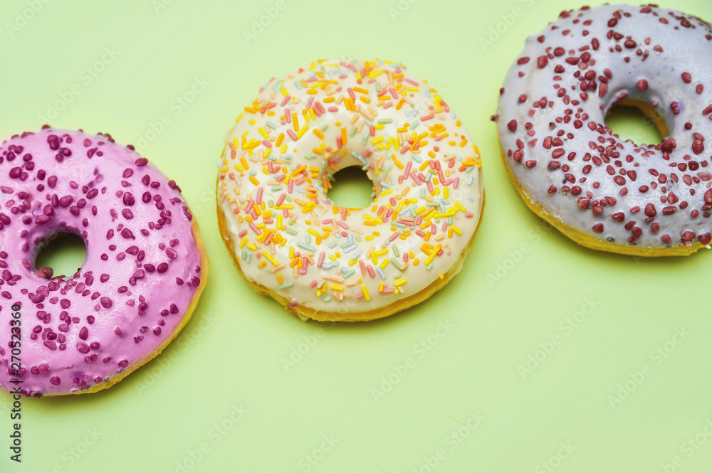 Tasty donuts on pink background. National donuts day.