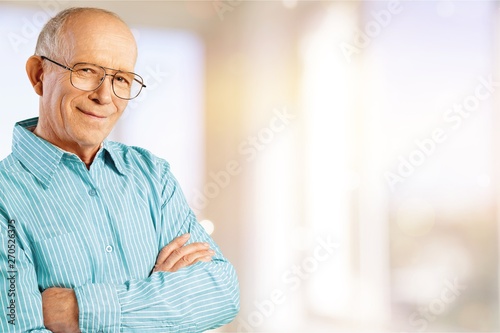 Happy senior man in blue shirt