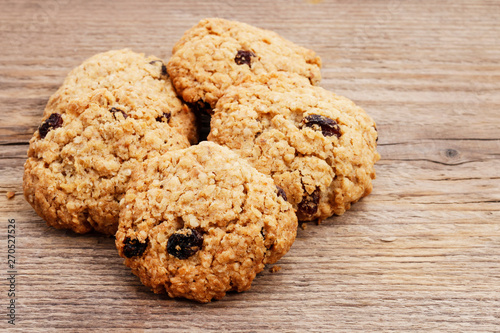 Fotografija Oatmeal cookies on wooden table.